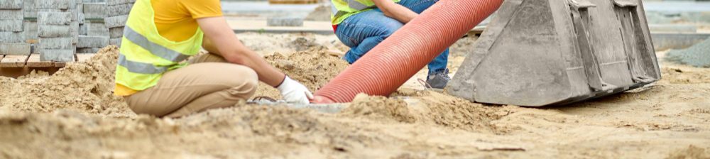 Drainlayers working in a trench on an Auckland site