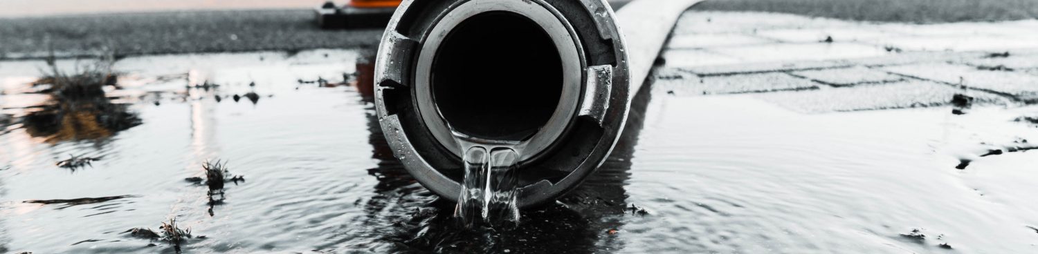 Stormwater pipe outlet discharging into water