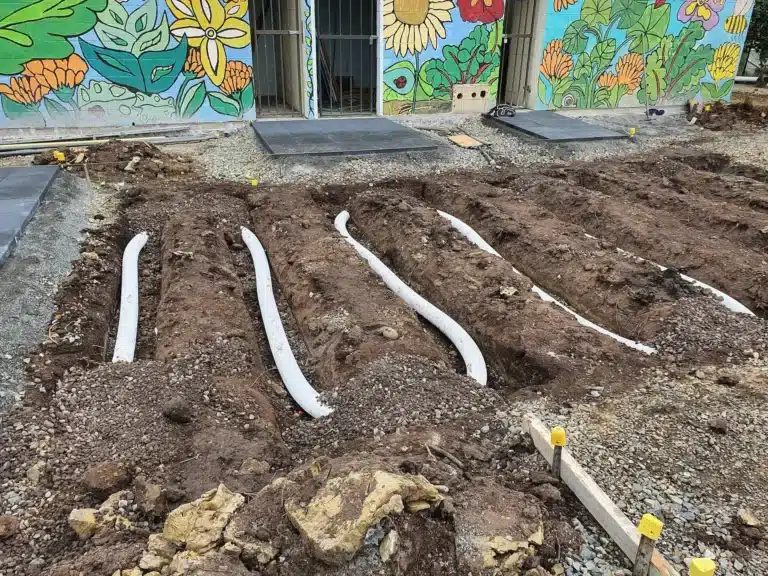 Subsoil drainage trenches with perforated pipe in a garden